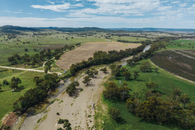 Aerial photo of rural river almost blocked by silt